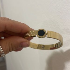 Gold tone bangle